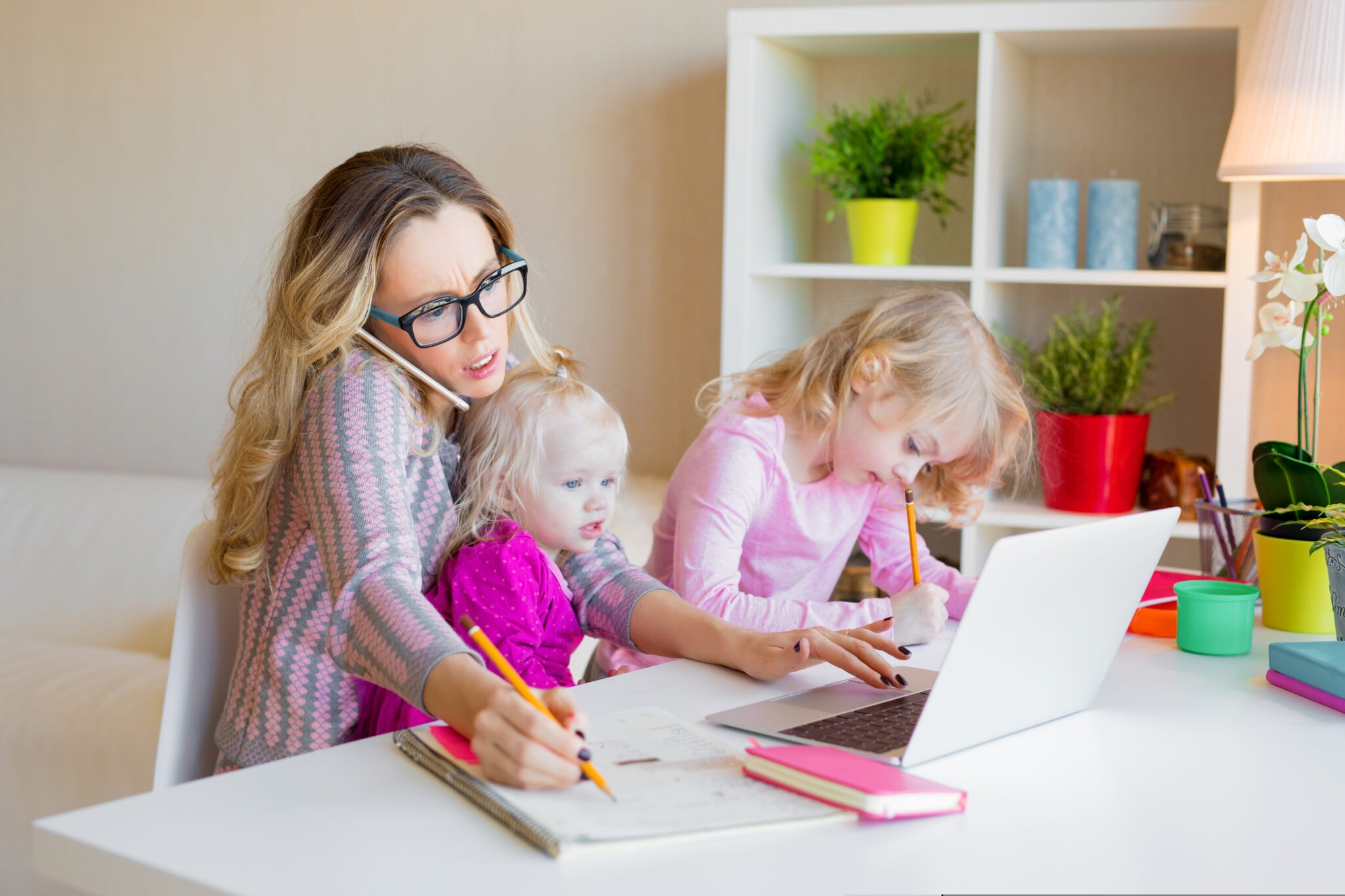 Busy,Woman,Trying,To,Work,While,Babysitting,Two,Kids