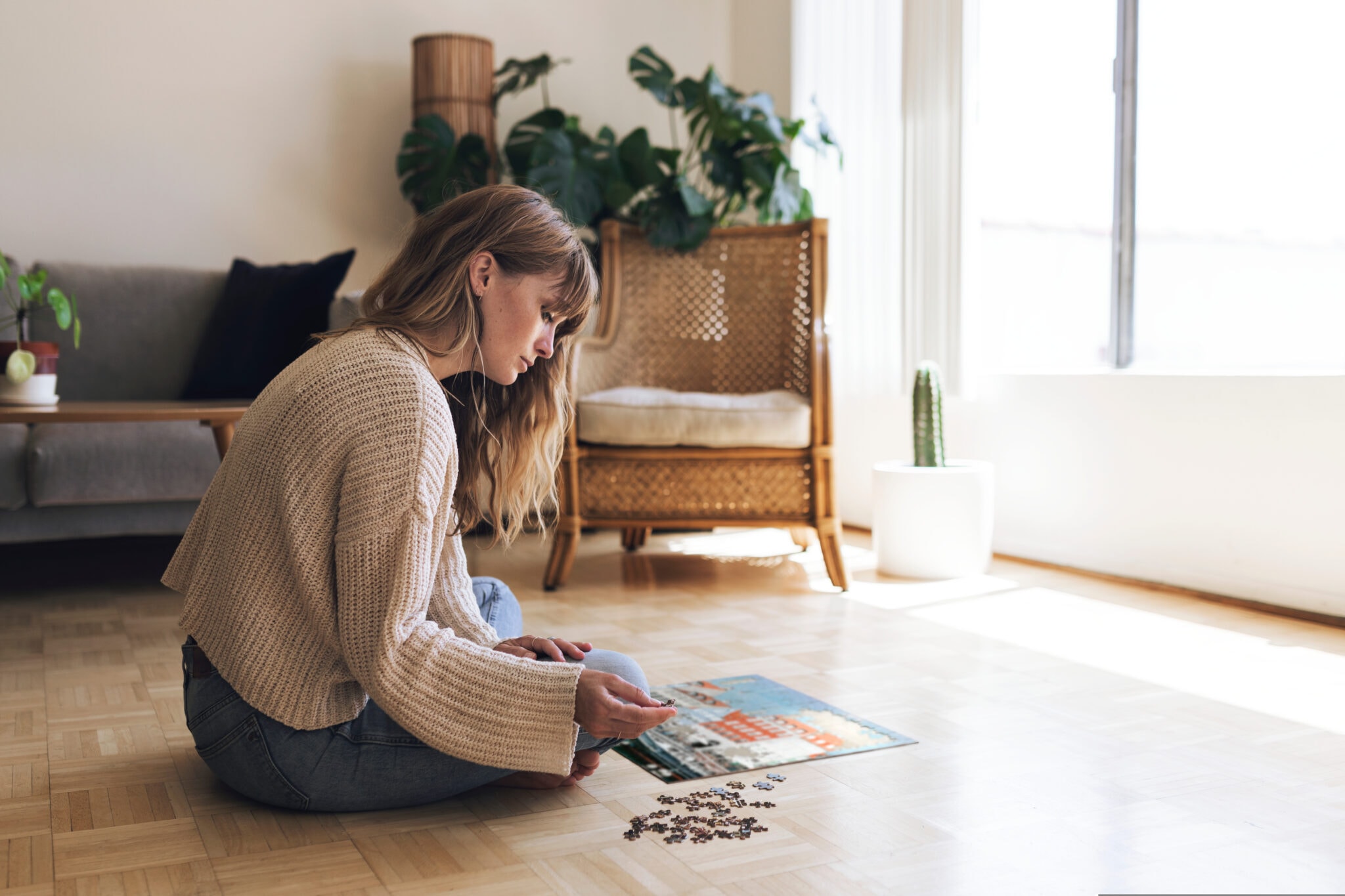 Woman,Assembling,A,Jigsaw,Puzzle,Of,Nyhavn,,Copenhagen,During,Coronavirus