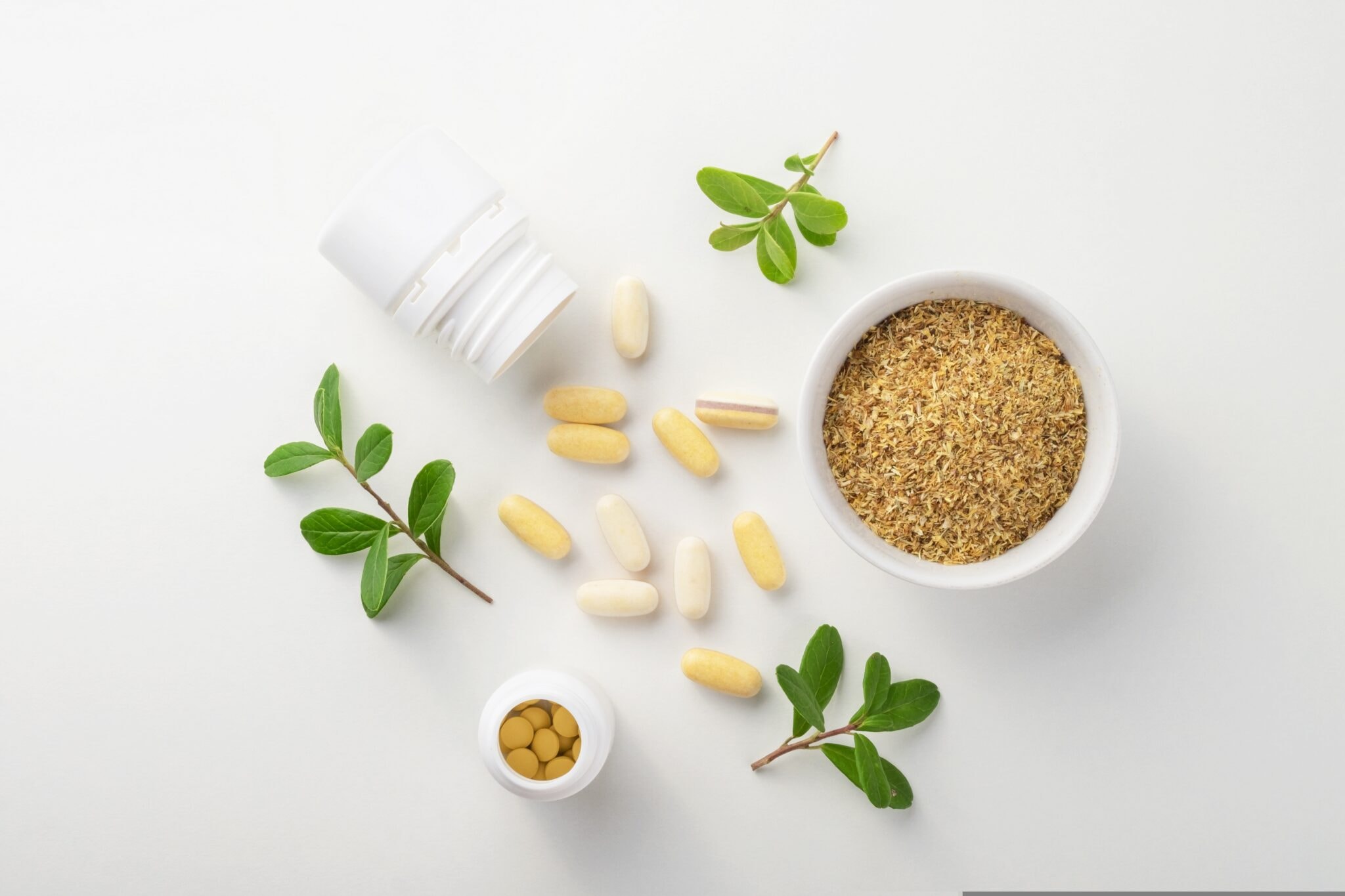 Vitamins,And,Herbal,Supplements,In,Jars,With,A,Green,Plant