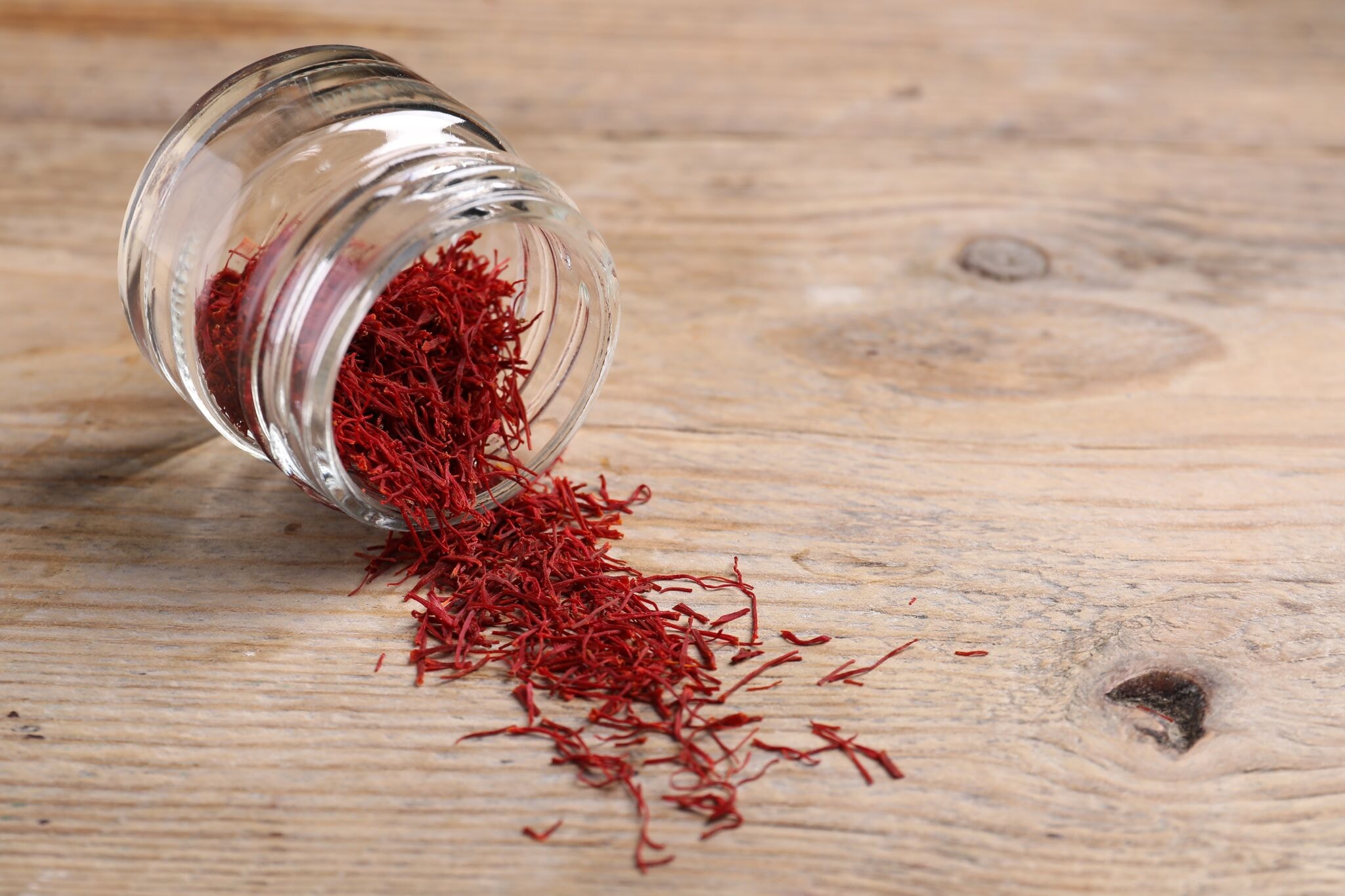 Aromatic,Saffron,In,Glass,Jar,On,Wooden,Table,,Space,For